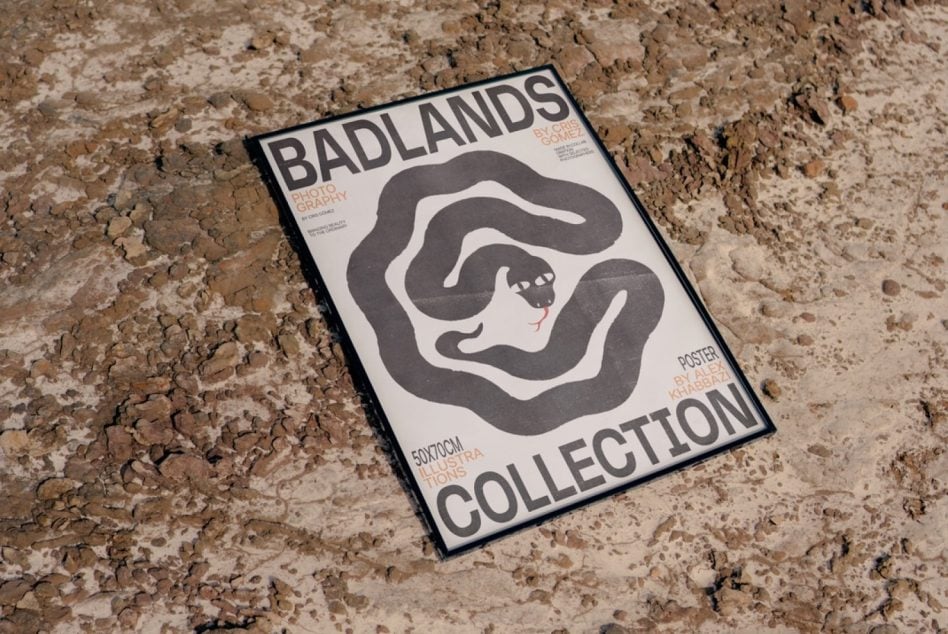 Badlands poster with wavy typography on cracked earth background