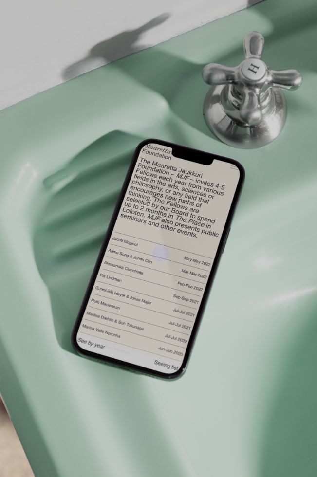 Smartphone mockup on sink showing text screen, design asset for apps, modern mobile display, editable template graphic for designers.