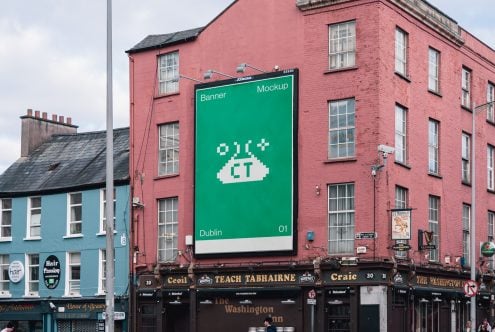 Green banner mockup with pixel art UFO on Dublin street corner
