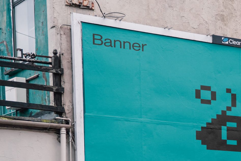 Turquoise banner on urban wall with brown pixelated corner graphic