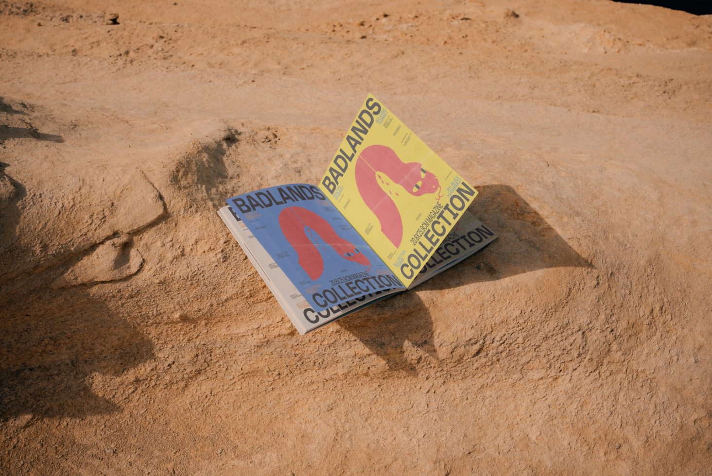 Magazine mockup on sandy terrain for graphic design showcasing bright cover art, highlighting print efficiency in natural settings for designers.