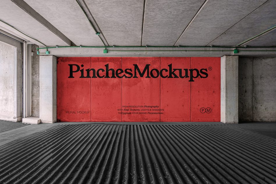 Large red mural mockup in concrete warehouse space with green rigging