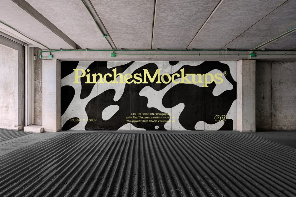 Curved black white pattern wall mural with yellow text in industrial space
