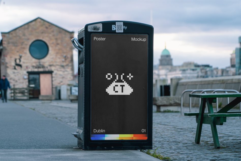 Black digital poster on Dublin street showing pixelated UFO logo against waterfront backdrop