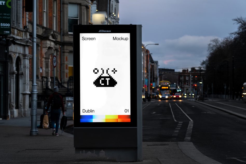 White JCDecaux billboard with black pixel UFO, color spectrum bar below