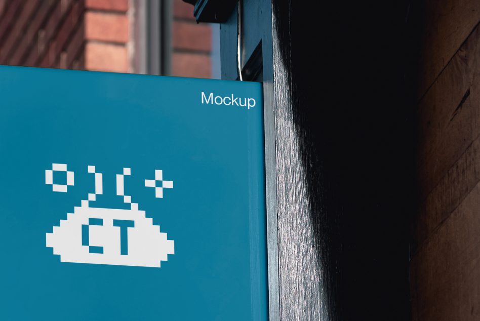 Teal blue storefront sign with pixel art cloud logo on wood frame