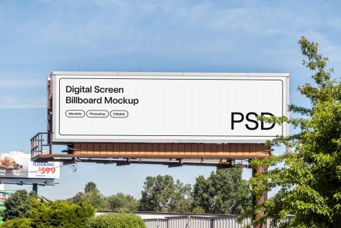 Highway billboard mockup against blue sky with trees on sides of road