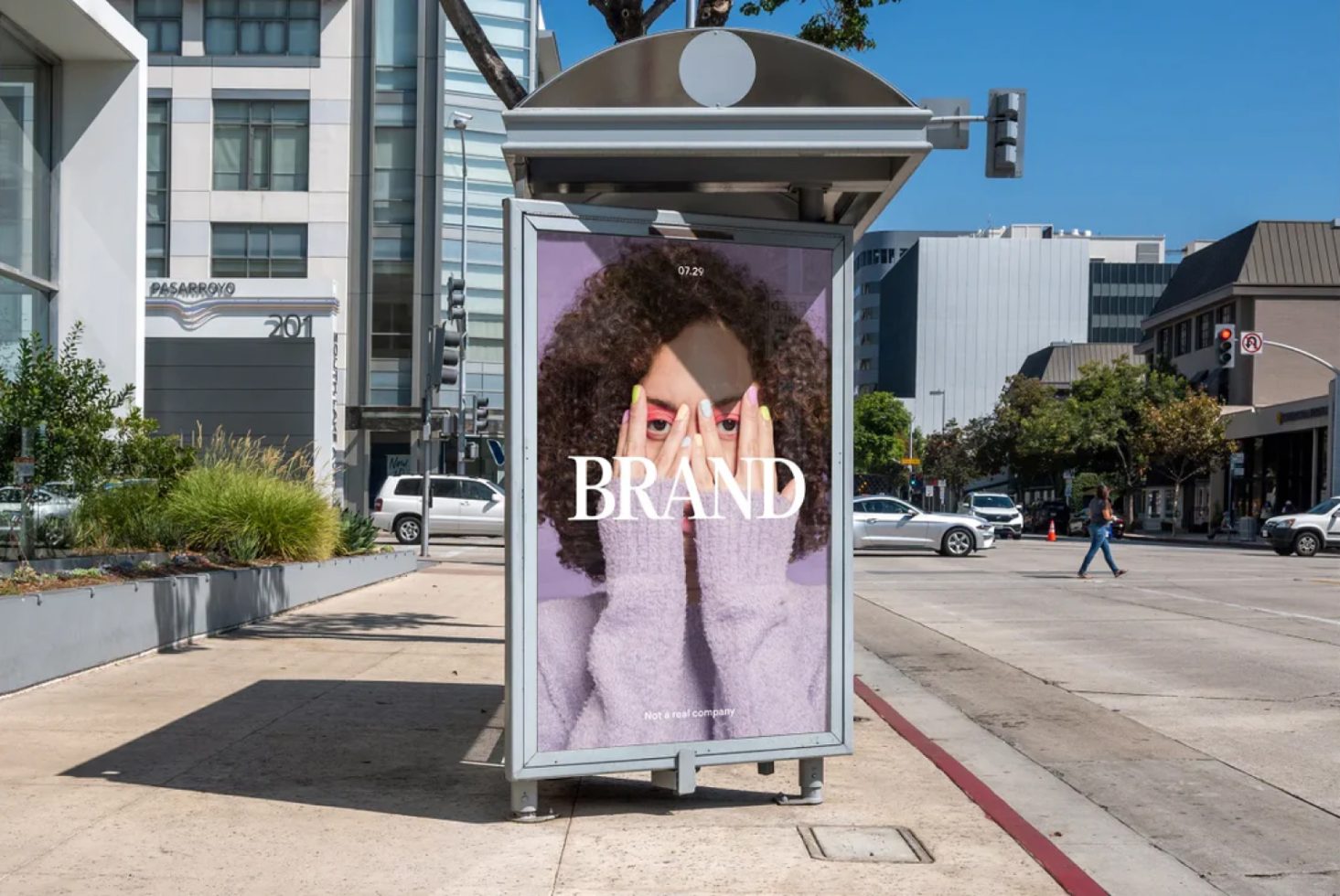 Outdoor advertisement mockup featuring a woman covering eyes with hands in a branded urban poster display design template.