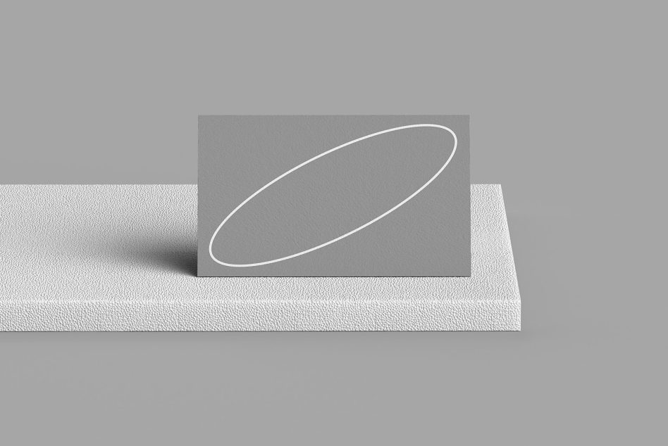 Light grey business card mockup with white neon shape on fabric