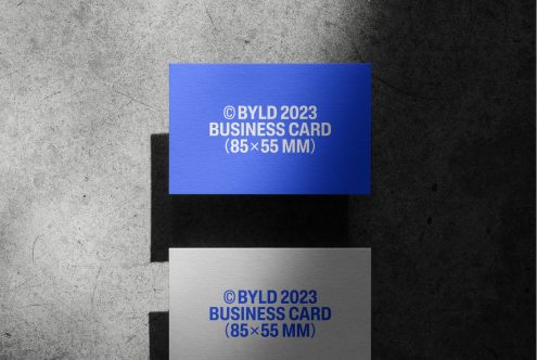 Blue and white textured business card mockup on a concrete background, ideal for designers, realistic shadow overlay, 85x55 mm.