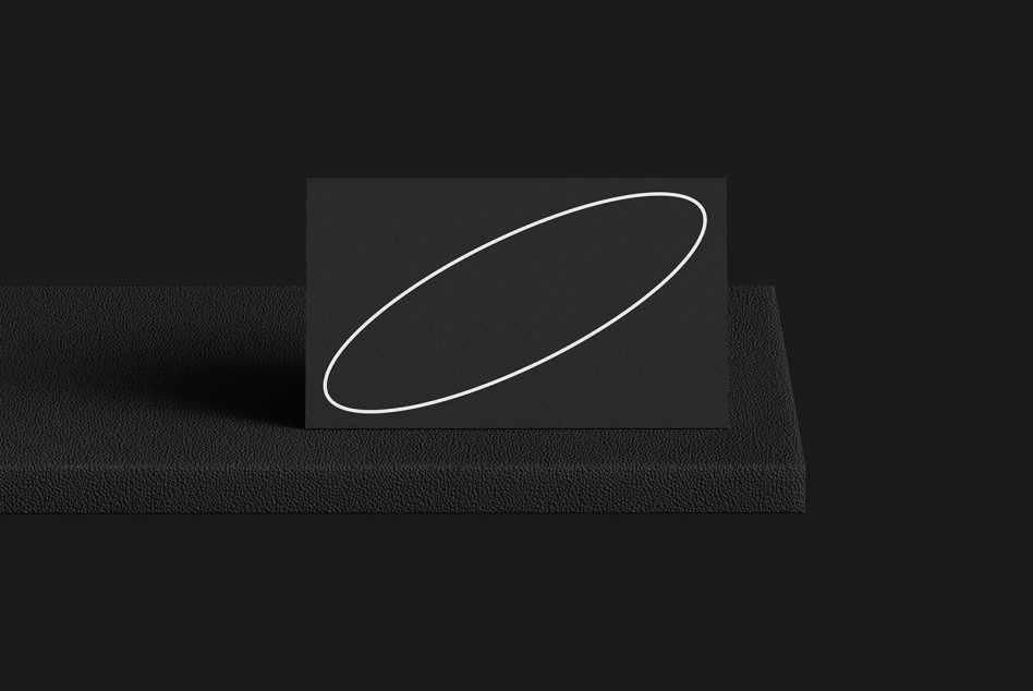 Dark business card mockup with white neon oval on textured fabric