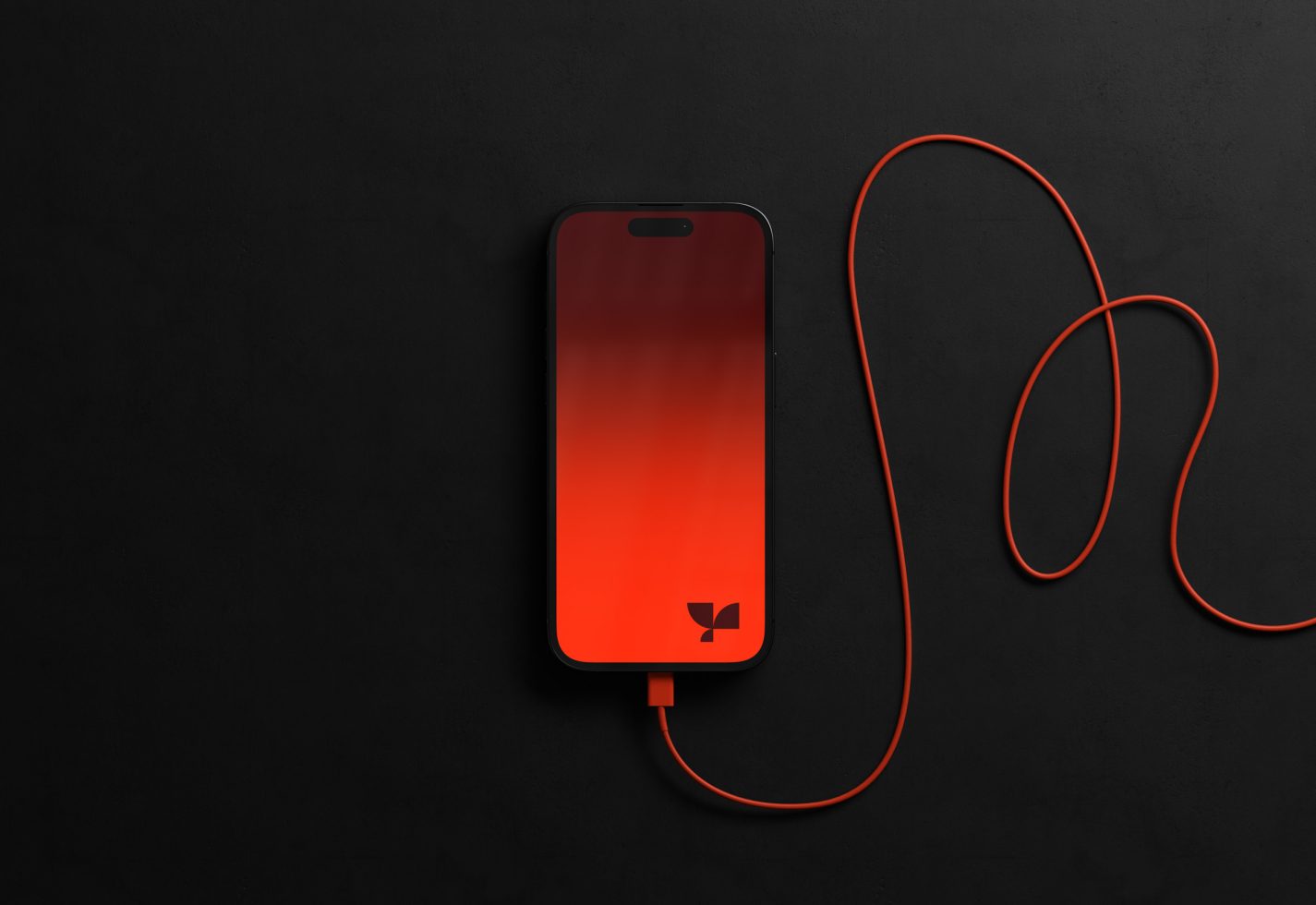 Smartphone mockup with orange screen and cable on a black background, ideal for presenting app designs and mobile interfaces.