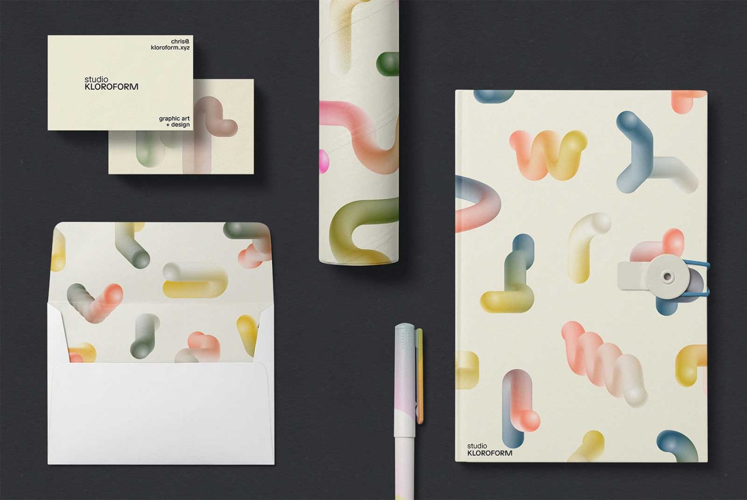 Creative abstract design templates with pastel organic shapes on business cards, notebook, and envelope, ideal for graphic designers, mockups.