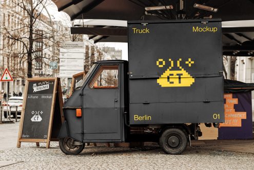 Black truck side panel mockup with yellow pixel art under bridge