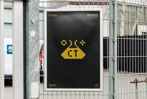 Pixel art UFO poster in metal frame on metal fence wall