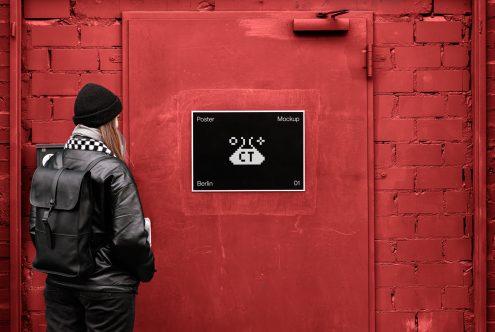 Person with backpack facing red brick wall with UFO poster mockup
