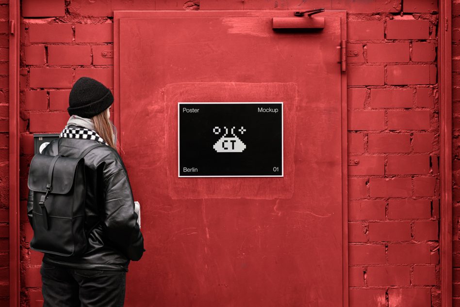 Person with backpack facing red brick wall with UFO poster mockup