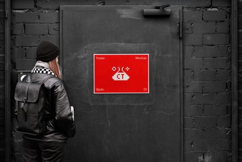 Person viewing red pixel UFO poster mockup on dark brick wall