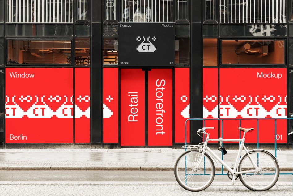 Red storefront window mockup with two bikes locked to blue rack