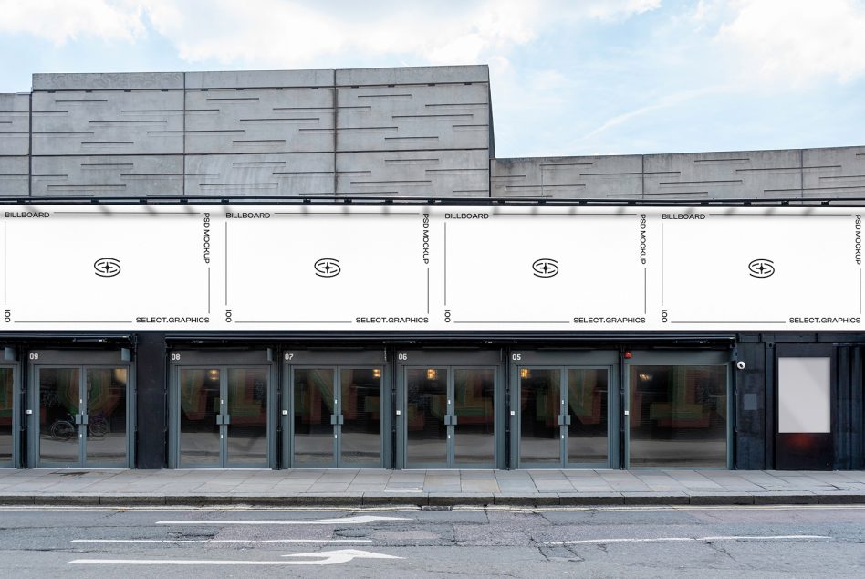 Modern storefront facade with blank billboards, numbered units, glass doors on street level