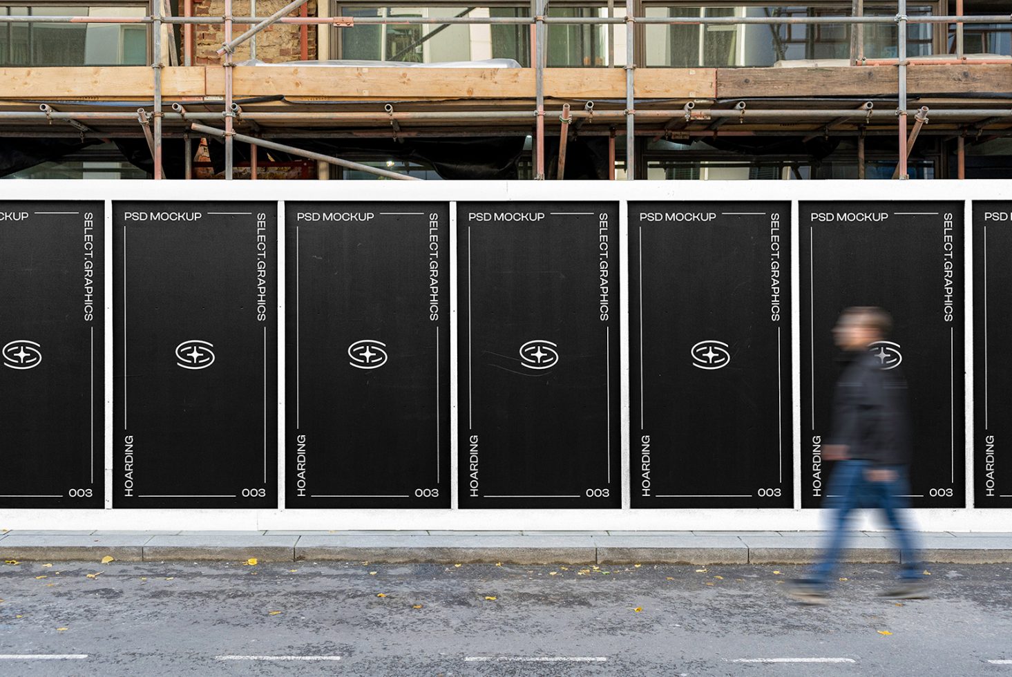 Alt: Urban wall mockups showcasing logo designs with a blurred person walking past, ideal for branding presentations in a realistic street setting.