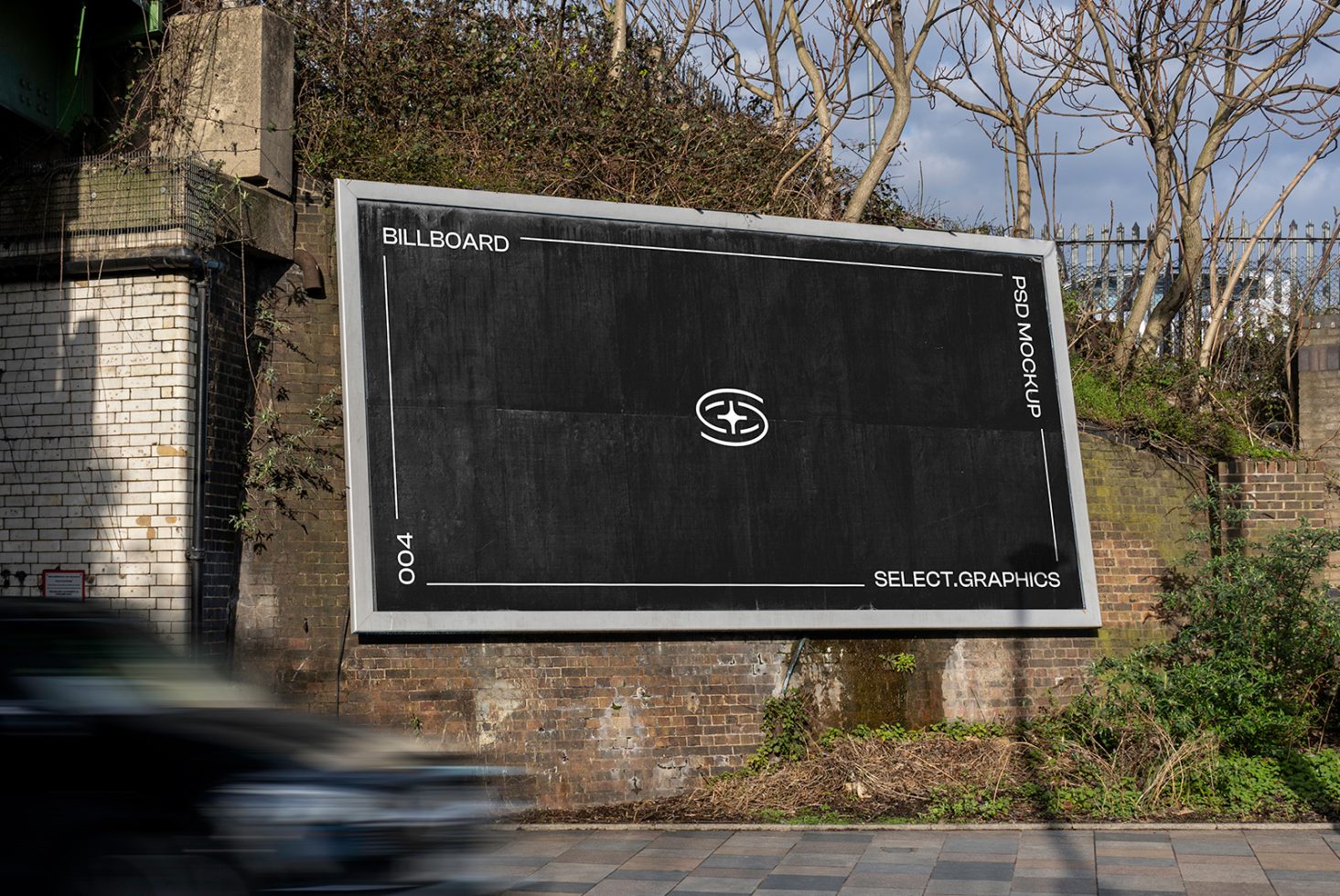 Urban billboard mockup for advertising on a brick wall beside a road, showing clear space for graphic design templates.