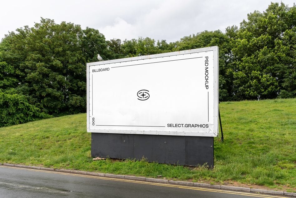 Light billboard mockup in green field with white frame border showing sample layout