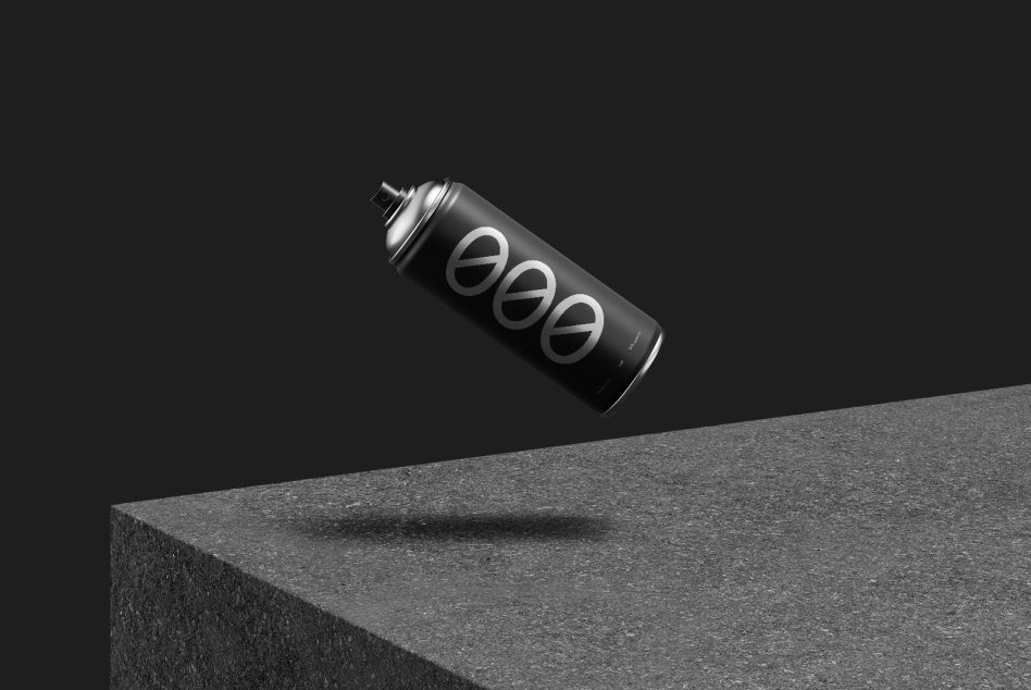 Black spray can floating above concrete edge with three circular logos visible