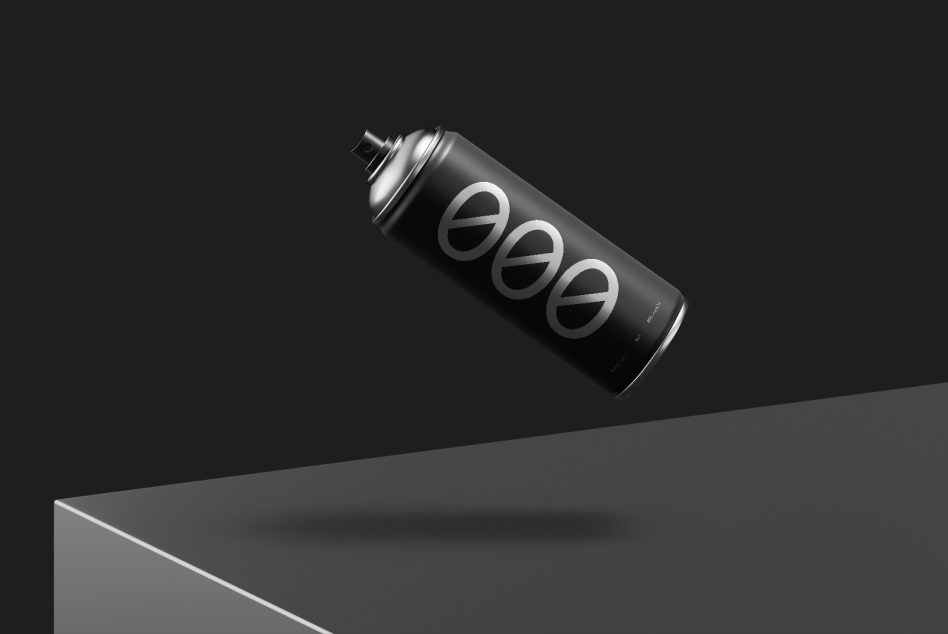 Black spray can with silver circular logo elements tilted on dark surface