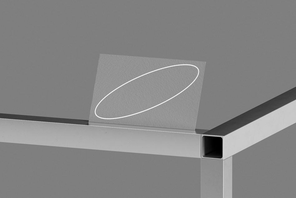 Gray business card featuring white oval stroke design detail