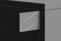 Gray card with curved white line detail on concrete backdrop