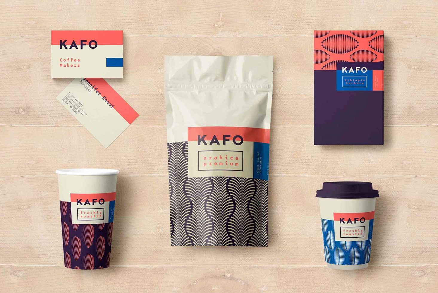 Brand packaging mockup set for coffee including bags, cups, and business cards on a wooden surface, ideal for coffee shop design.