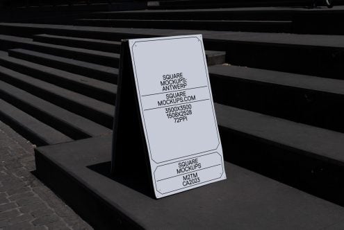 Sidewalk sandwich board mockup with white screen on concrete steps