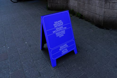 Bright neon blue A-frame pavement sign mockup on street with illuminated edges