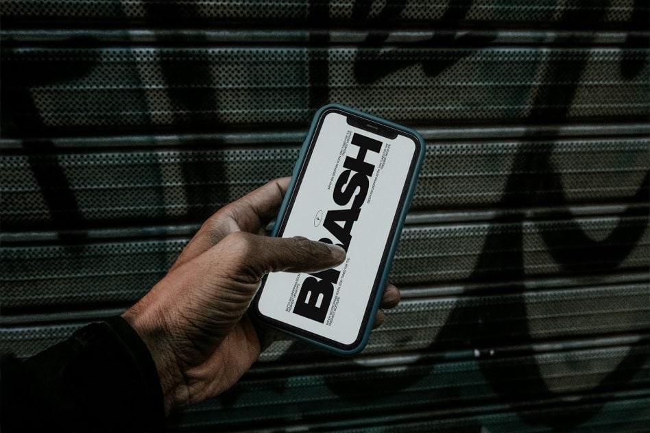 Blue phone with bold sans serif typeface mockup on metal grill background