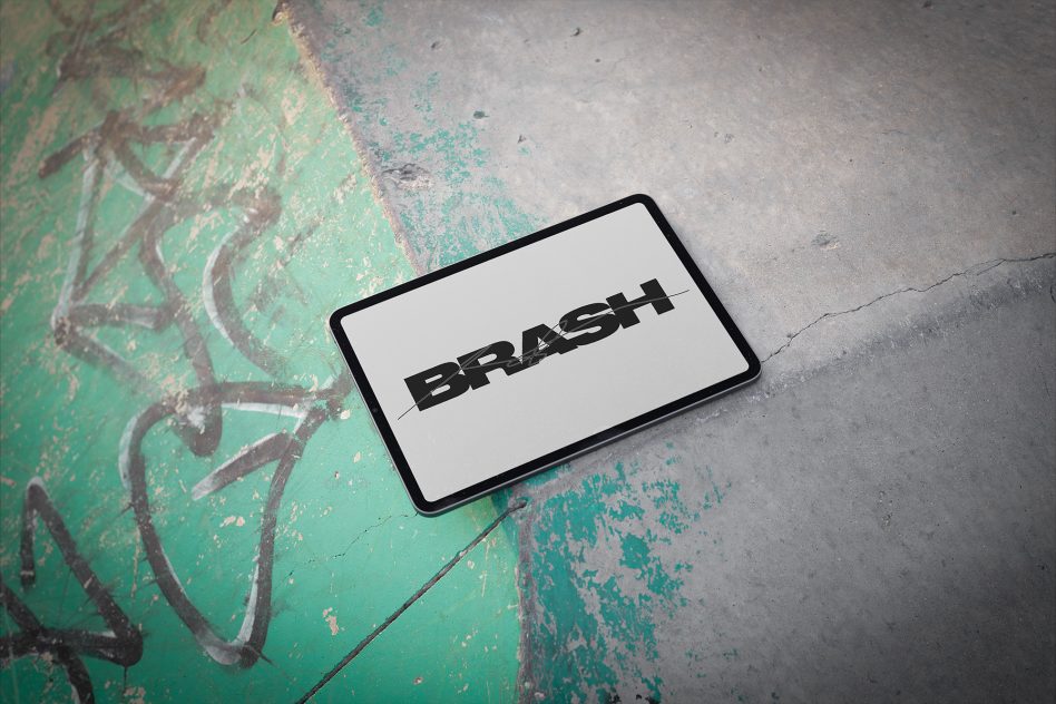 Device on painted surface showing BRASH text on light background