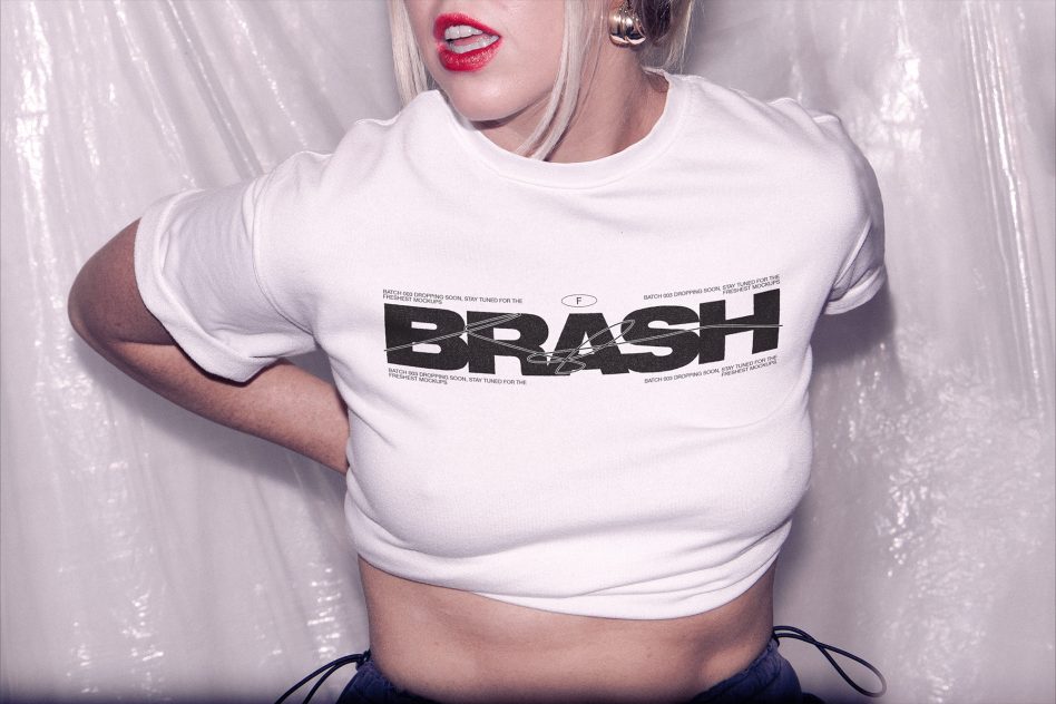 White fitted crop tee mockup featuring bold broken letter design across front