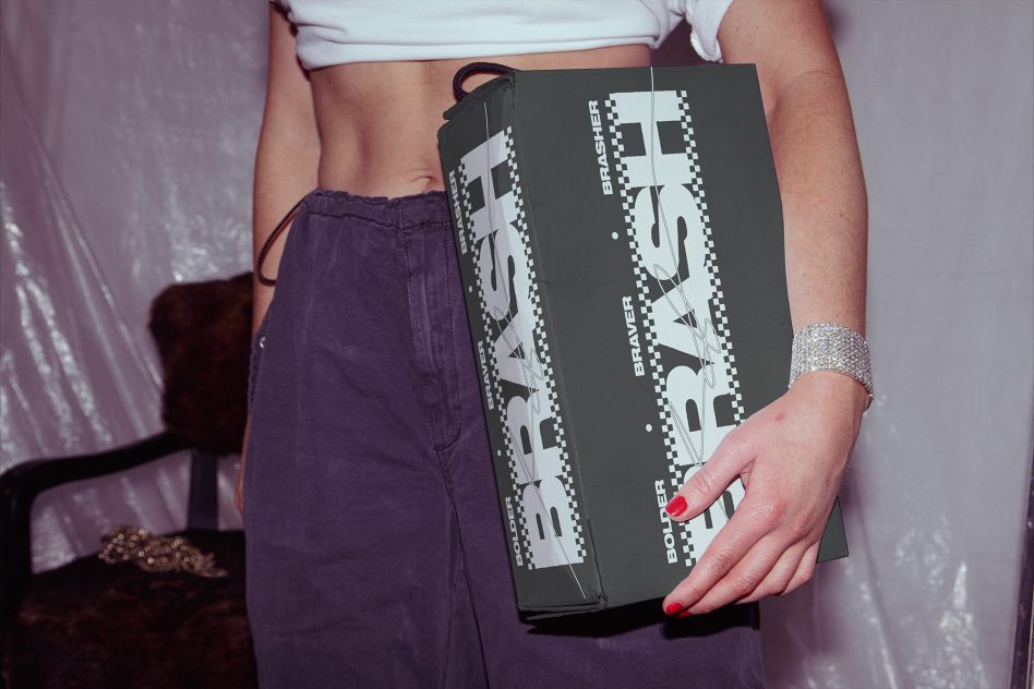 Dark charcoal BRASH clutch with minimalist geometric design