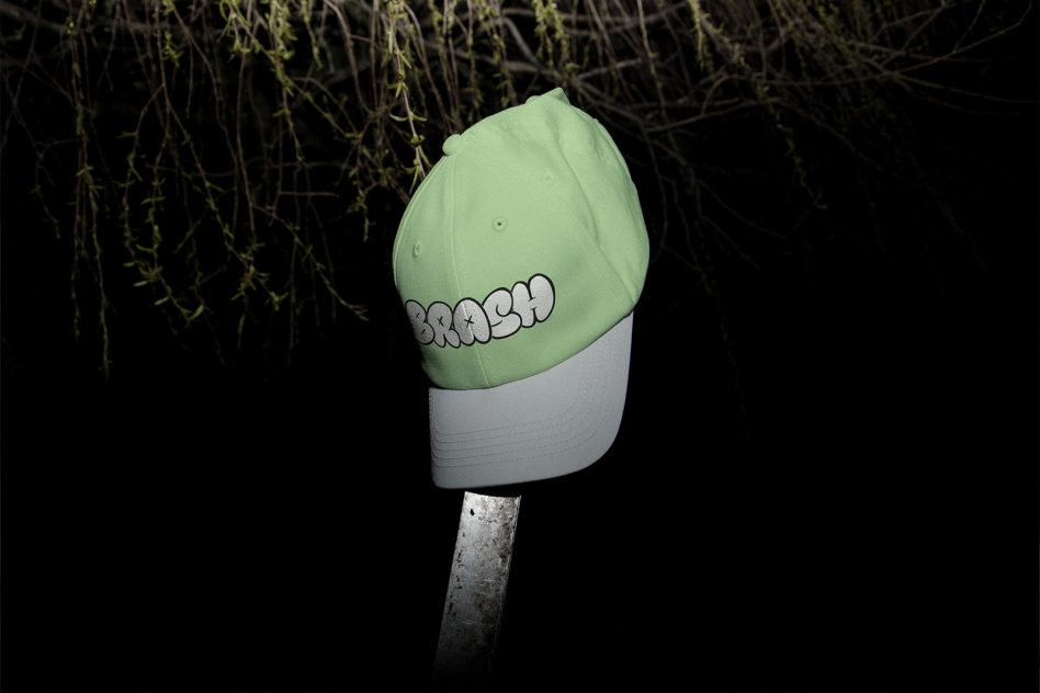 Mint green color-blocked cap with BRASH graffiti style text on side