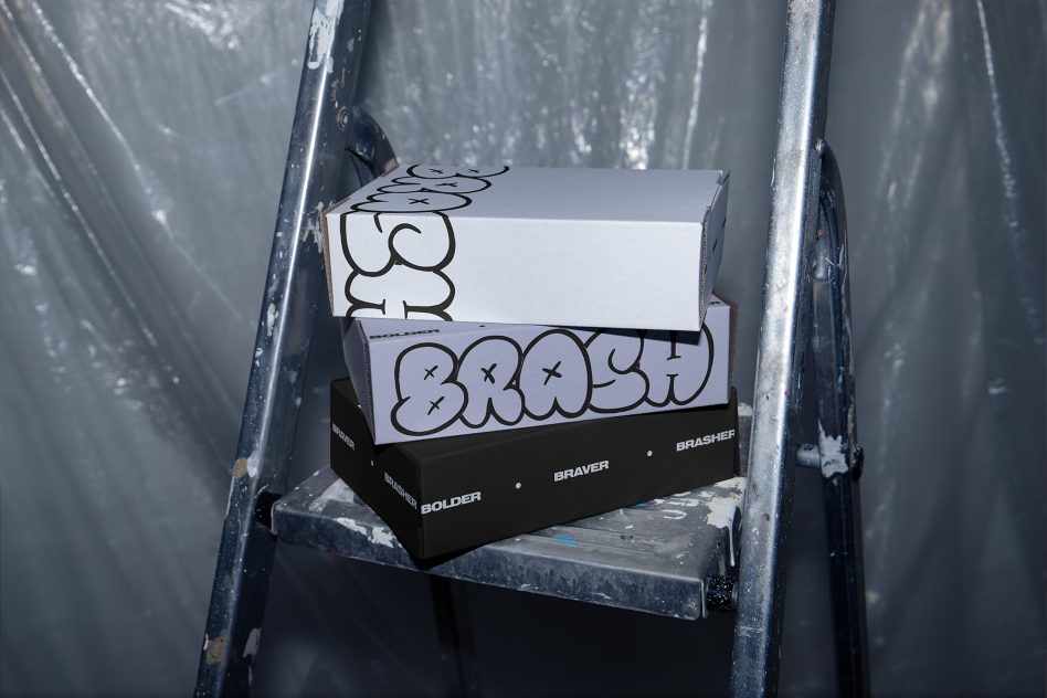 Stacked boxes with bubble doodle lettering on metal shelf brackets