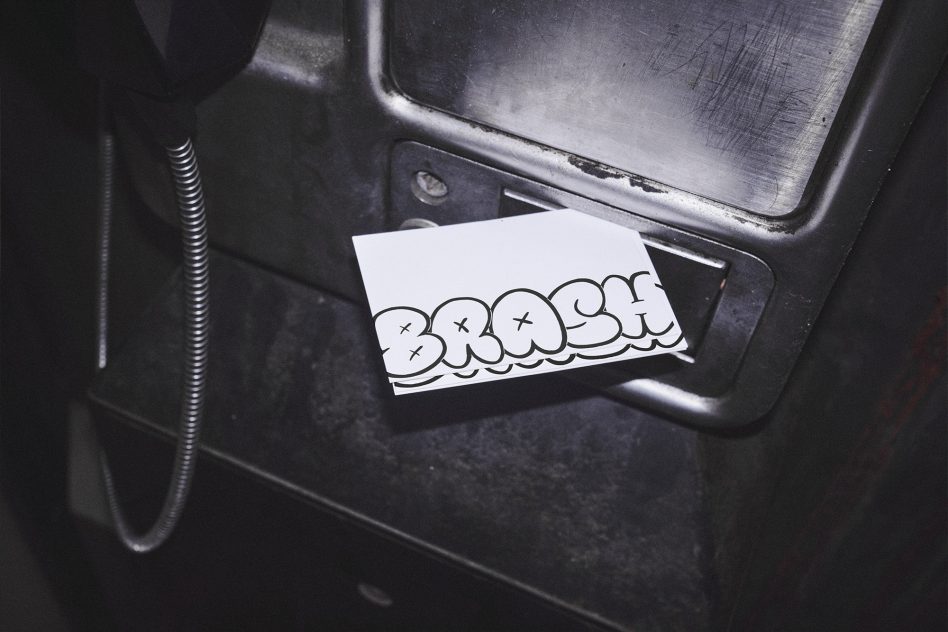 Business card mockup with bubble letter graffiti design inside weathered car door
