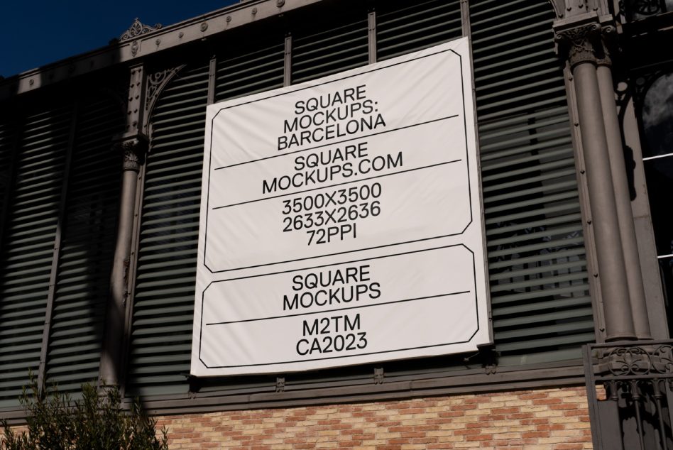 Large square billboard mounted on industrial metal wall with cream background mockup