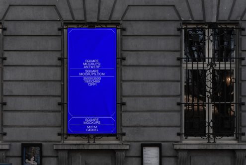 Bright blue window display mockup on dark modern storefront facade