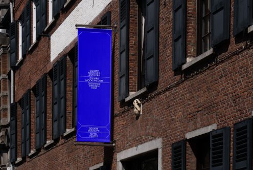 Glowing blue hanging sign mockup on exposed brick building exterior