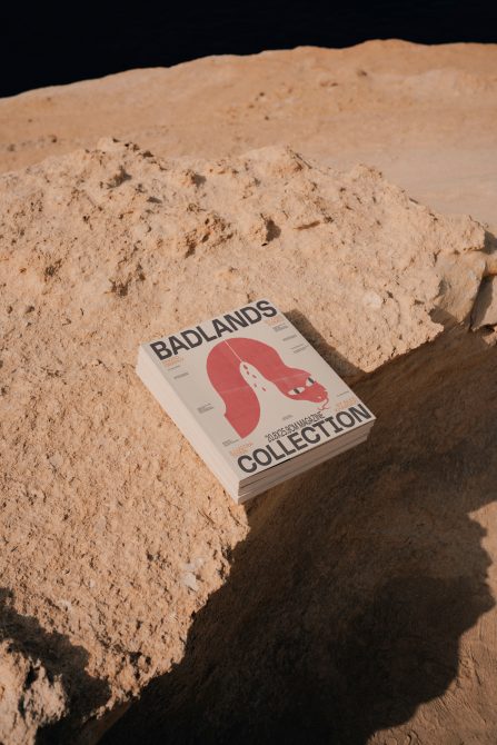 Magazine cover mockup on natural rock texture in sunlight, showcasing editorial design, visual identity for inspiration in desert theme.