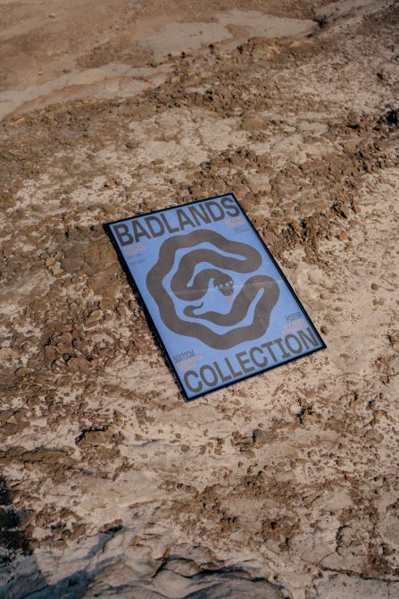 Magazine mockup on textured ground, Badlands Collection, graphic design display, natural outdoor light, realistic presentation for designers.