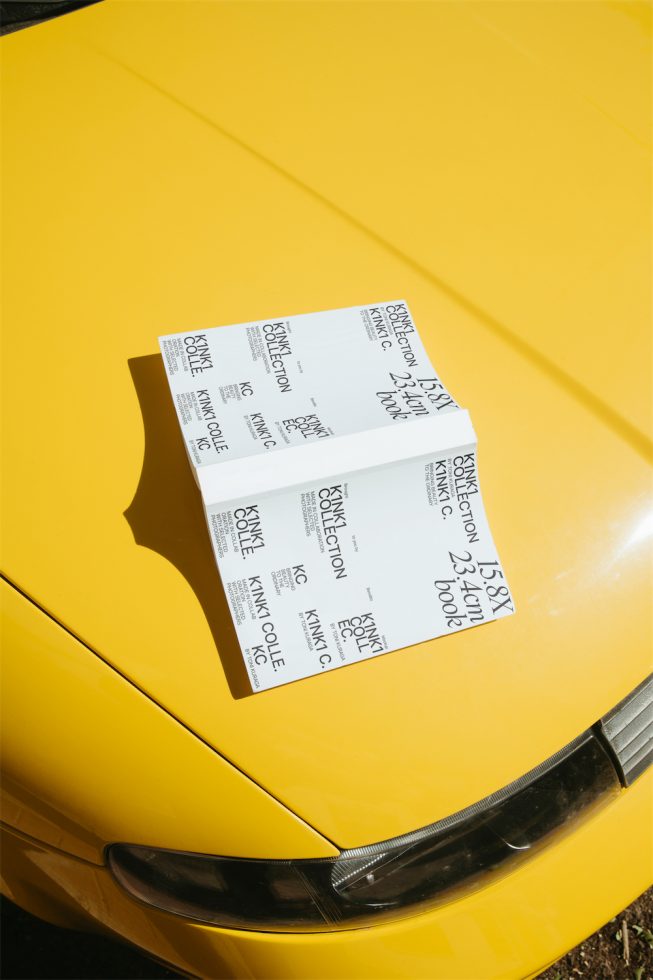 Bright yellow sports car hood with parking ticket mockup in natural sunlight perfect for graphic design assets and presentation templates.