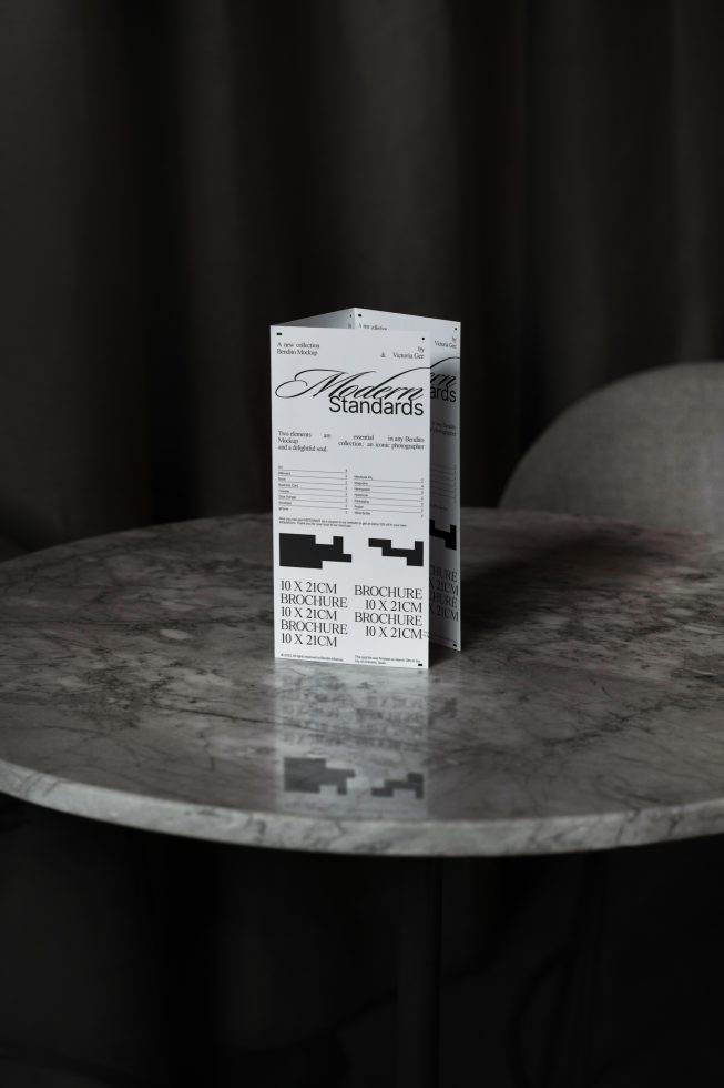 Elegant brochure mockup on marble table for realistic presentation, featuring minimalist design, perfect for showcasing templates and graphics.