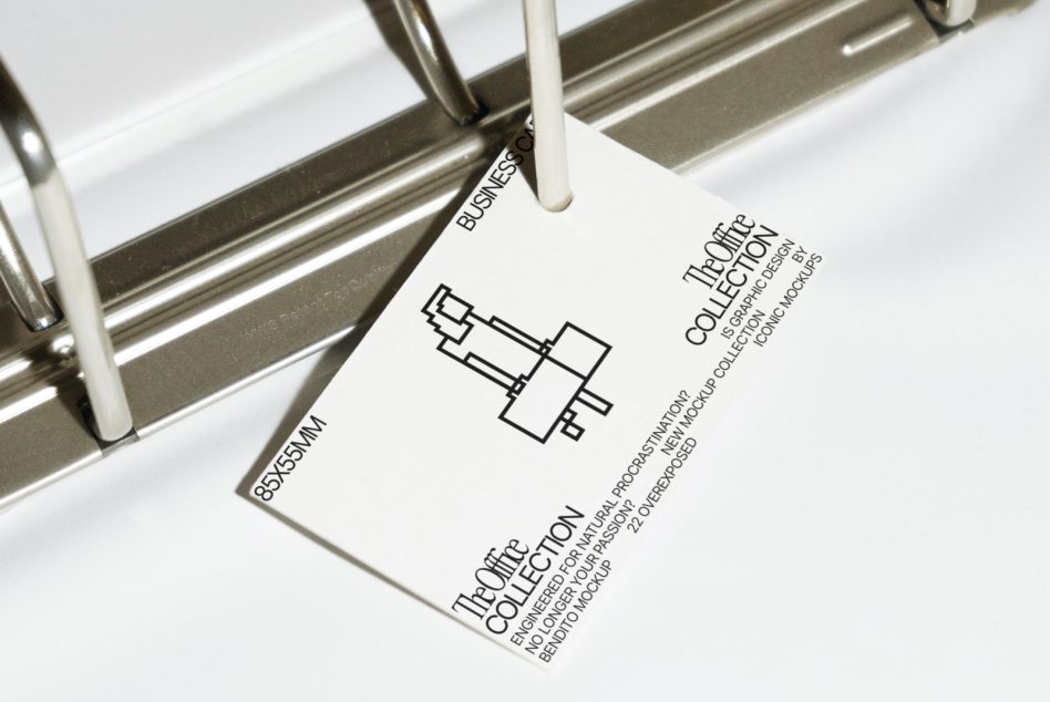 Modern business card mockup on metal holder emphasizing minimalist design, ideal for showcasing branding graphics to designers.