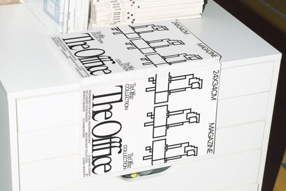Magazine lying on white desk showing Office Collection cover with chair layouts